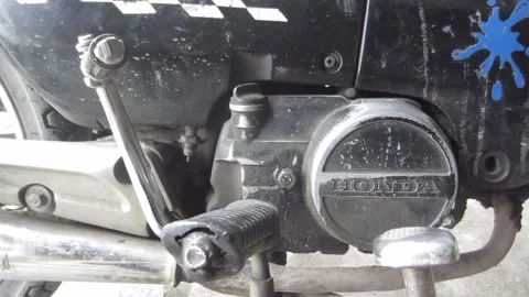 Vintage motorcycle engine block, close-up metal kickstarter lever and footrest 스톡 동영상 205542169
