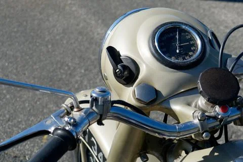 Vintage motorcycle standing on the road Stock Photos