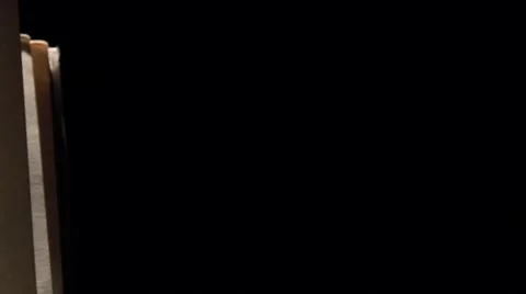 Vintage music notes with ray of light on black, cam moves to the left, close up Stock Footage 59906522