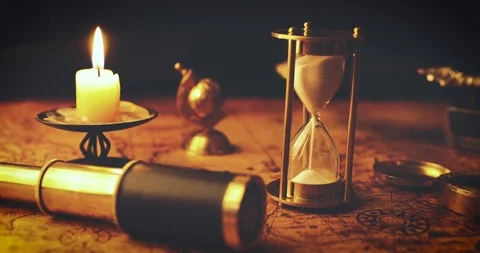 Vintage nautical items on old world map in candlelight Stock Footage 104089324