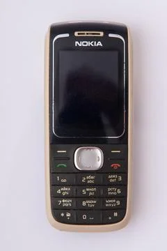 Vintage Nokia push button mobile phone. Classic cellular telephone on white b Stock Photos