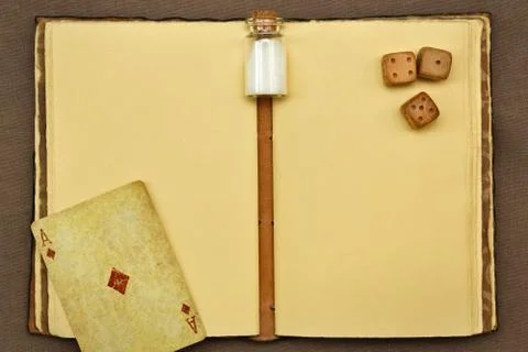 Vintage notepad, jar with something white, playing card and dices Stock Photos