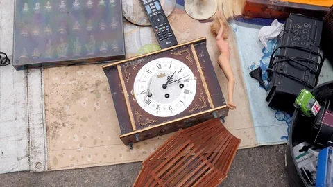 Vintage objects displayed on the ground at flea market Stock Footage 116130301