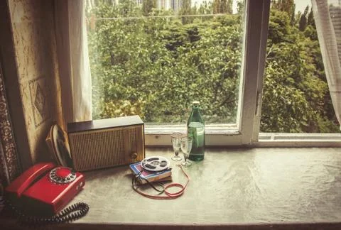 Vintage objects on windowsill. Retro interior Stock Photos