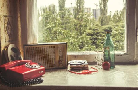 Vintage objects on windowsill. Retro interior Stock Photos