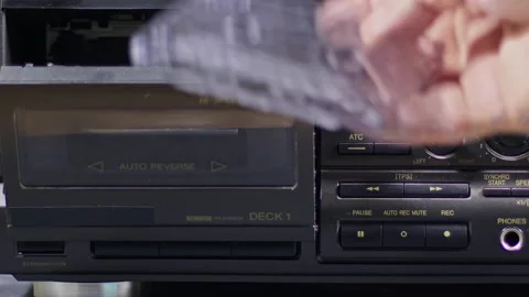 Vintage Old Cassette Insert and Playing From Old Cassette Player Stock Footage 186584607