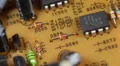 Vintage Old Tech Electronic Board Resistors Capacitors Integrated Yellow Circuit HD Footage