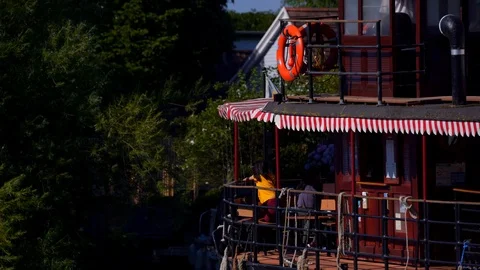 Vintage paddle boat float past on river thames with tourists and passengers Stock Footage 111336089
