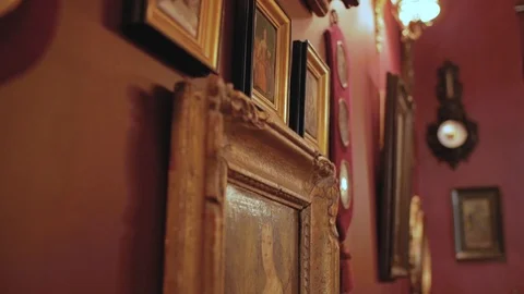 Vintage paintings on the wall in retro frame Stock Footage