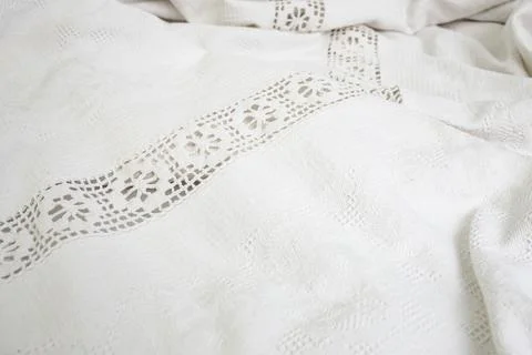 Vintage patterned table cloth , white fabric folds abstract  backdrop Foto stock