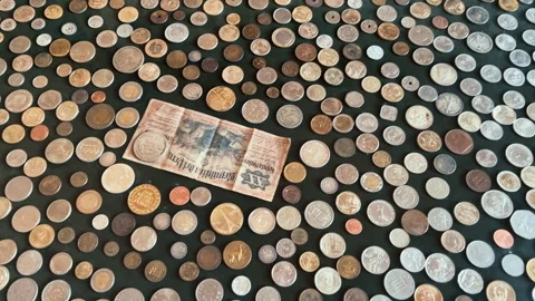Vintage Peruvian Banknote and Diverse International Coin Collection Stock Footage 339713694