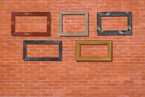 Vintage photo frames on brick wall for interior or background. イラスト素材