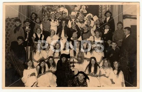 Vintage photo shows pupils to pose after theatre performance. Black & white p Stock Photos