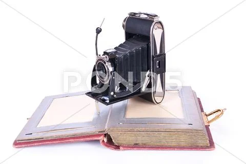 Vintage photography camera with old photoalbum Stock Photos