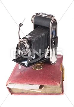 Vintage photography camera with old photoalbum Stock Photos