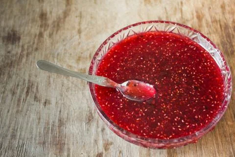 Vintage plate with raspberry jam Stock Photos
