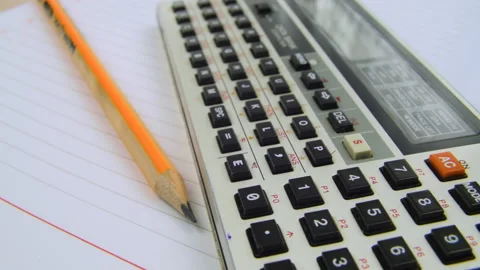 Vintage pocket computer data bank and pencil on a notebook Stock Footage 235956586