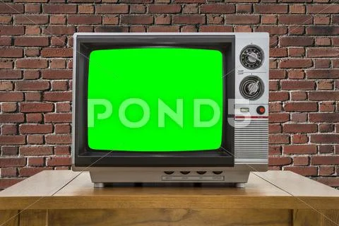 Vintage Portable Television With Red Brick Wall And Chroma Green Screen