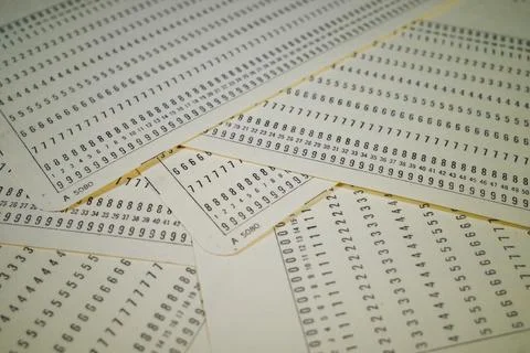 Vintage Punched Cards with Numerical Patterns 写真素材
