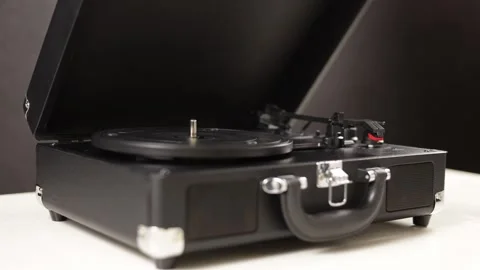 Vintage record player opening and closing with a hand Stock Footage 339004405