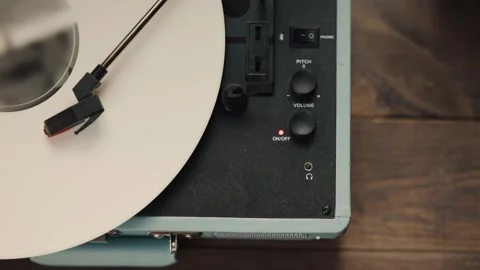 Vintage record player playing white vinyl disc, nostalgic audio equipment Stock Footage 345602543
