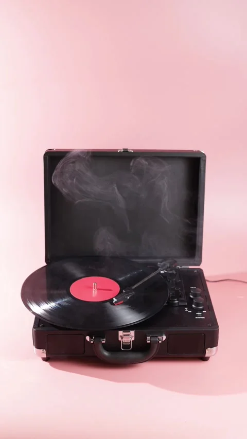 Vintage record player with smoke effect on pink background Stock Footage 339001267