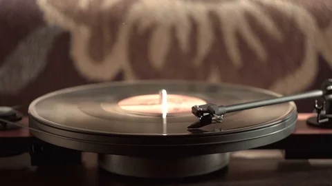 Vintage record player with vinyl disc, close-up. warm sunlight Stock Footage 79628843