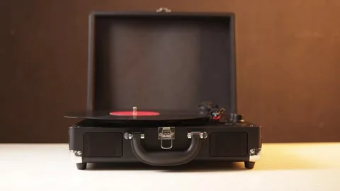 Vintage record player with vinyl disc being placed on turntable Stock Footage 339004114