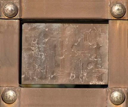 Vintage rectangular plate in metal frame with rivets 写真素材