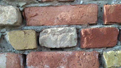 Vintage red bricks as building blocks: aged wall of an old building Stock Footage 213997921