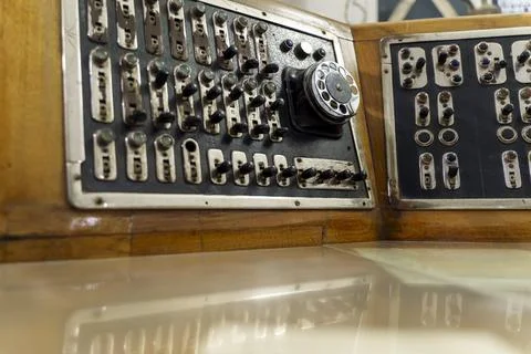 Vintage remote control with levers, light bulbs and dial telephone Stock Photos