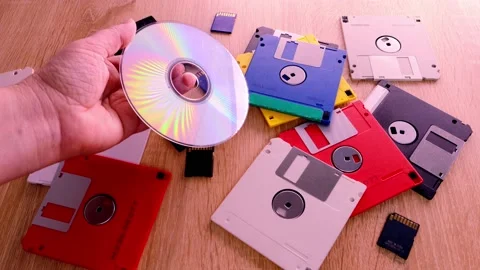 Vintage retro electronic data storage devices from the 80s, 90s, cd disk, fla Stock Footage 171388735