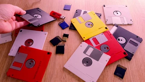 Vintage retro electronic data storage devices from the 80s, 90s, cd disk, fla Stock Footage 221737397