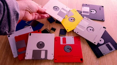 Vintage retro electronic data storage devices from the 80s, 90s, cd disk, f.. Stock Footage 238743590