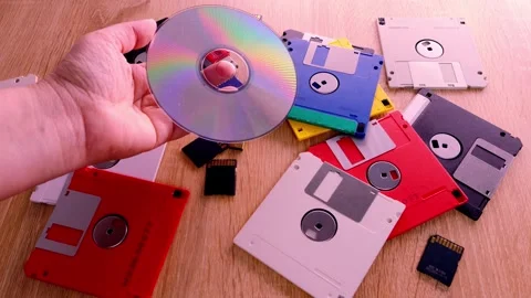 Vintage retro electronic data storage devices from the 80s, 90s, cd disk, f.. Stock Footage 242924992