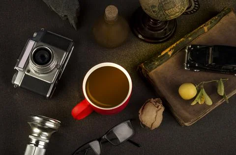 Vintage rustic theme table with coffee cup and still life objects Stock Photos