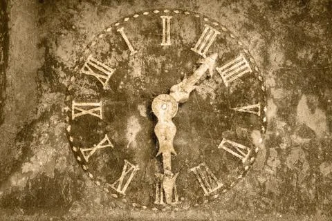 Vintage rusty clock in front of a stone background Stock Photos