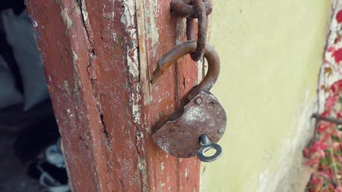 Vintage Rusty Padlock With A Key Hanging At The Door Of An Old House Stock Footage 171904616