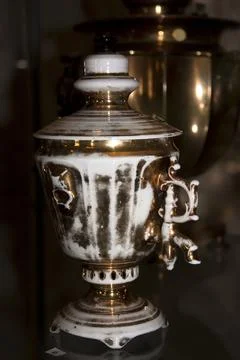 Vintage samovar on a black background. Selective focus. Stock Photos