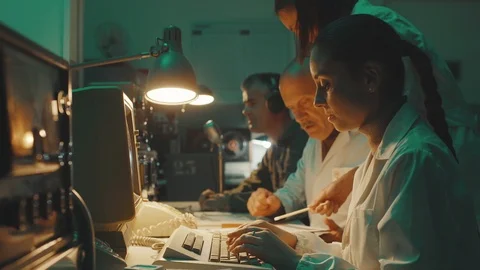 Vintage sci-fi scientists working in a operation room Stock Footage 116173282