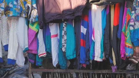 Vintage second hand hat and clothes rail showing colourful vintage clothes on Stock-Footage 122875807