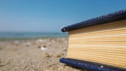 Vintage Serenity: Macro Close-Up of Closed Book by the sea Video stock 250469713