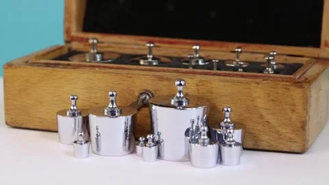 Vintage set of small analytical weights in wooden box Stock Footage 310058654