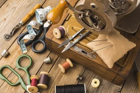 Vintage sewing machine with thread scissors Stock Photos
