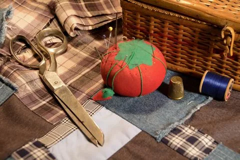 Vintage sewing on a patchwork quilt Stock Photos