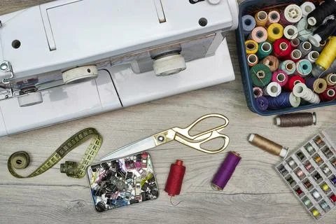 Vintage Sewing Studio Setup With White Sewing Machine, Scissors, Thread Spools,  Stock Photos