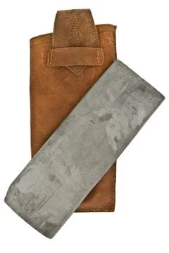 Vintage sharpening stone Stock Photos