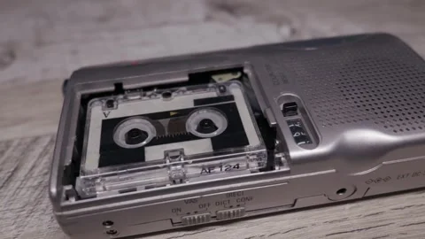 Vintage Silver Dictaphone With Micro Cassette Tape On Wooden Desk Vídeos de archivo 329972760