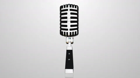 Vintage silver microphone rotating on gray background Stock Footage 61074786