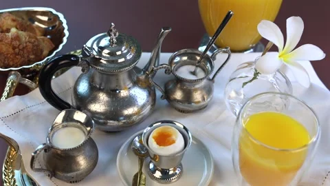 Vintage silverware and classic tableware embrace nostalgic tea-time charm. Fresh Stock-Footage 293734940